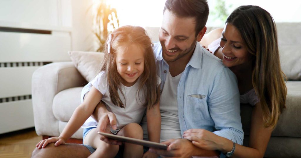 Family looking at home inspection on ipad